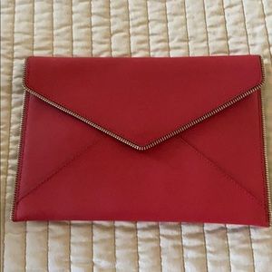 Red leather clutch. In great condition.